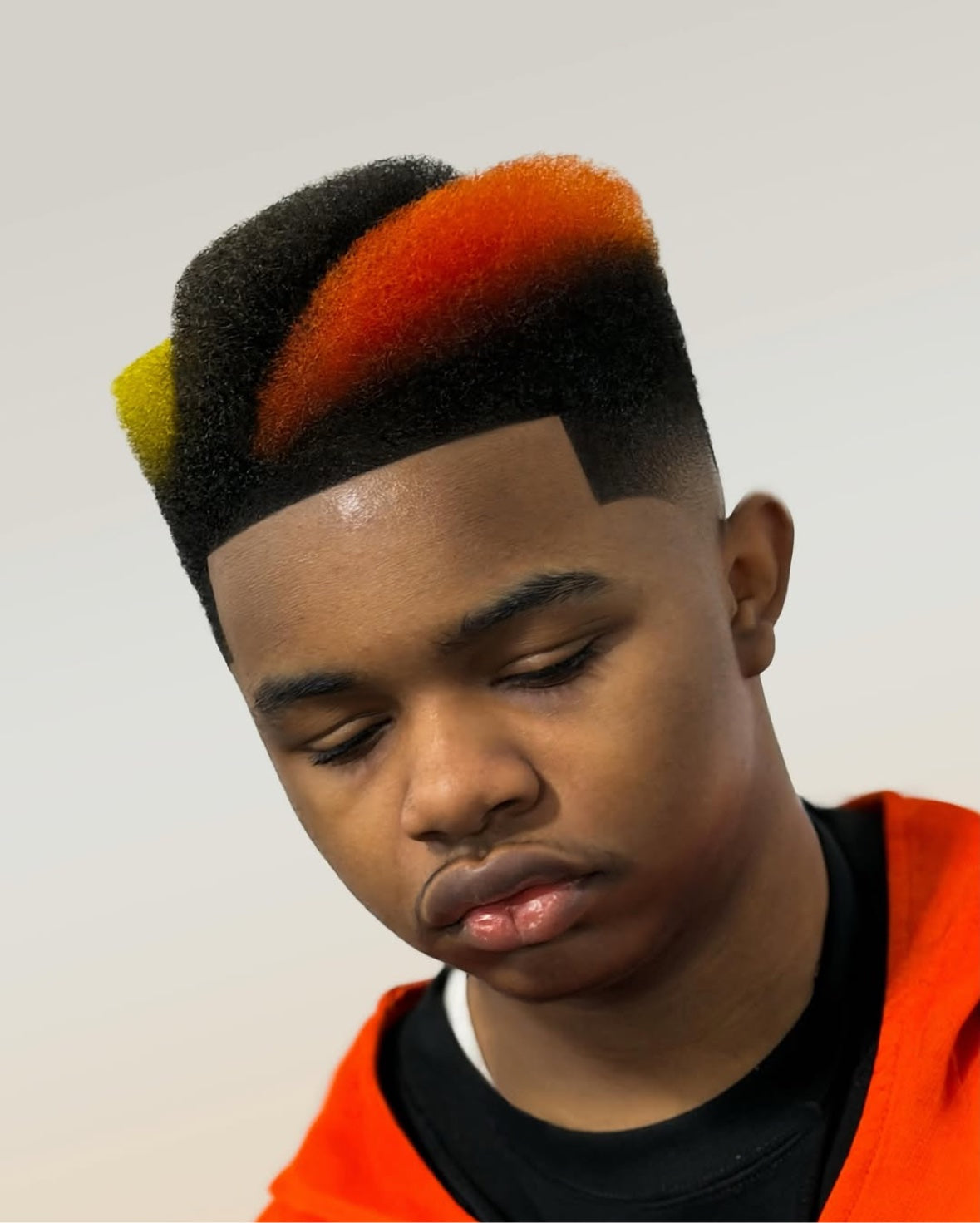Sculpted geometric barber design in black, orange and yellow